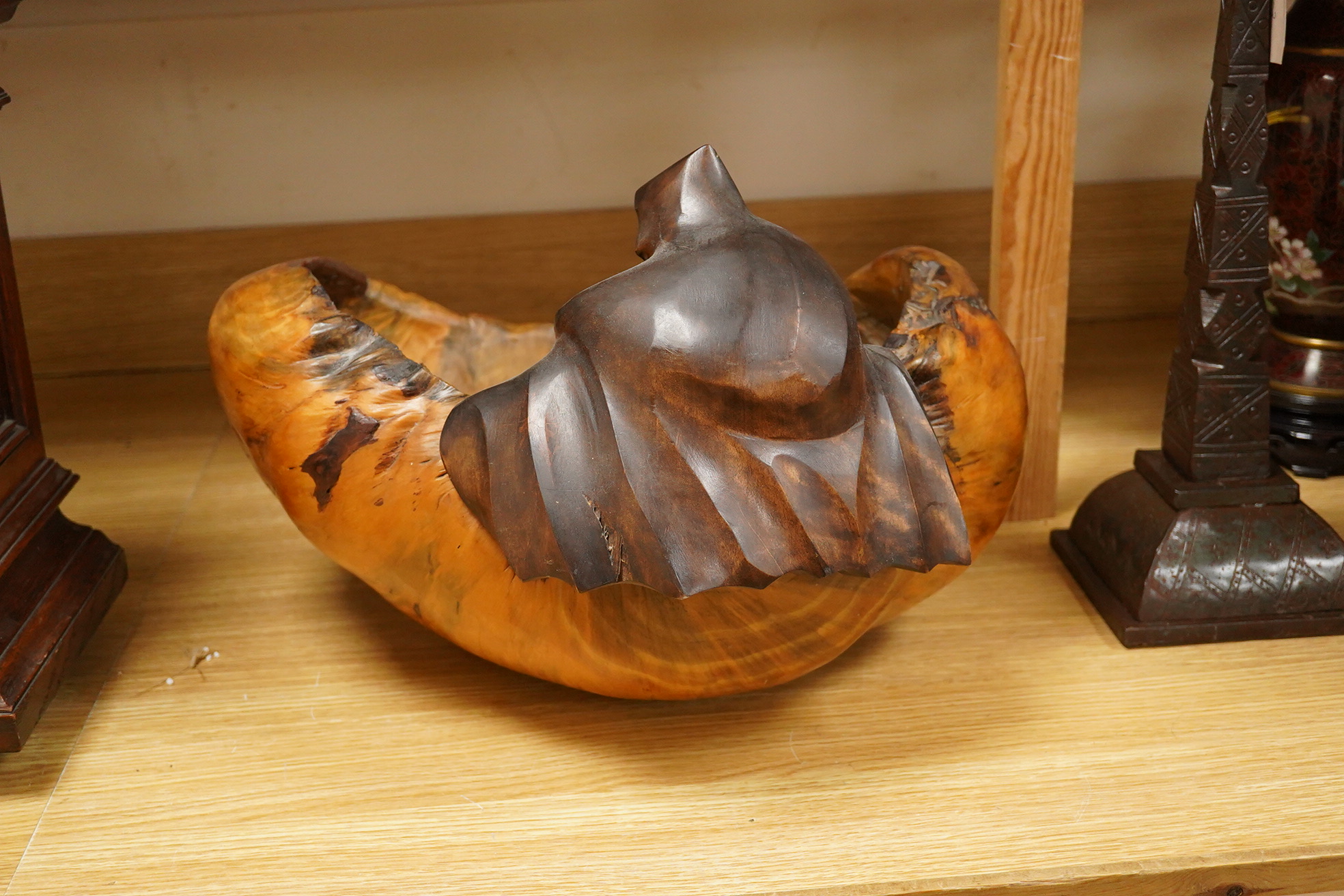 Pierre Decorse (b.1953), a large naturalistically modelled bowl carved with a cloaked figure, 42cm wide